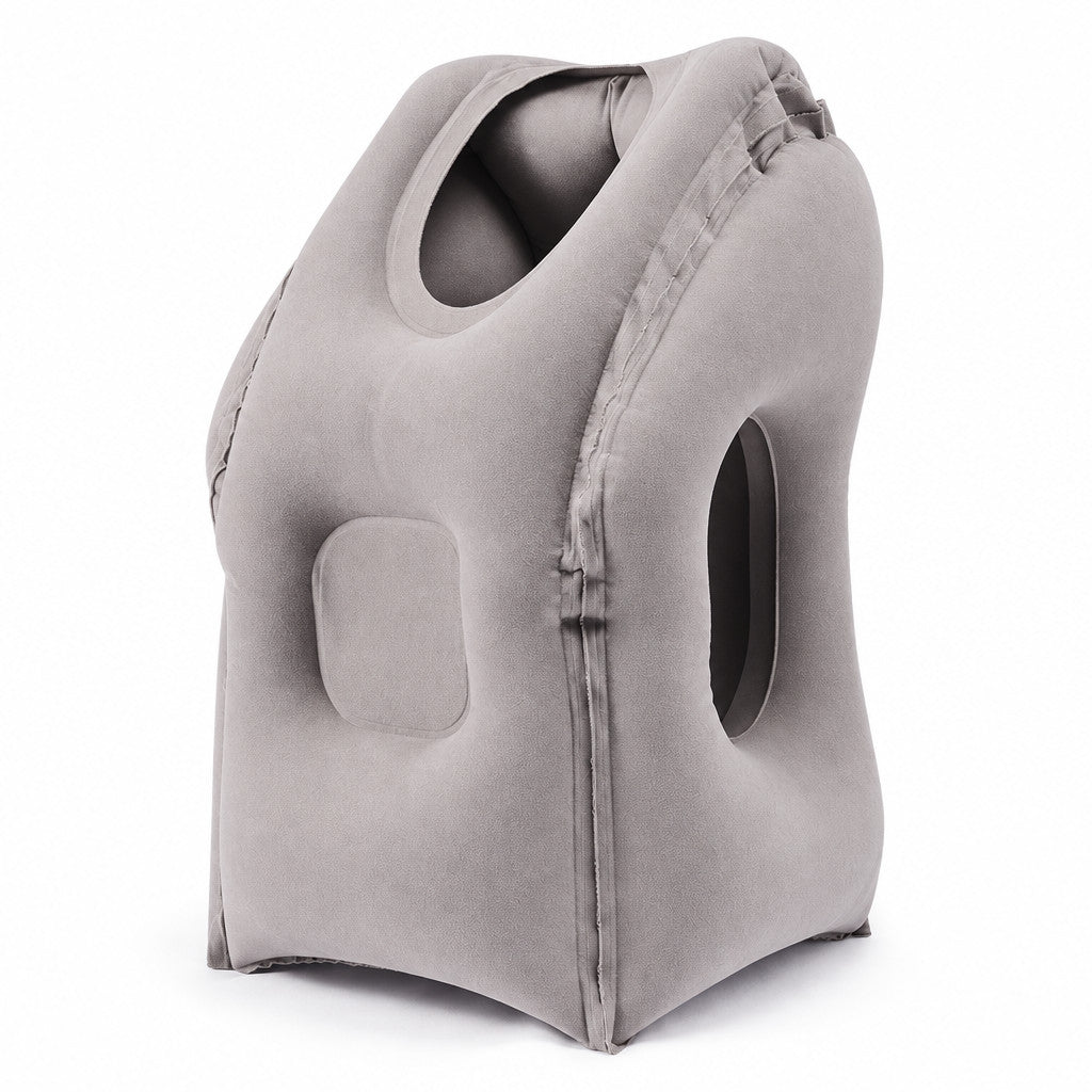Light grey inflatable travel sleep pillow with face opening and side arm opening