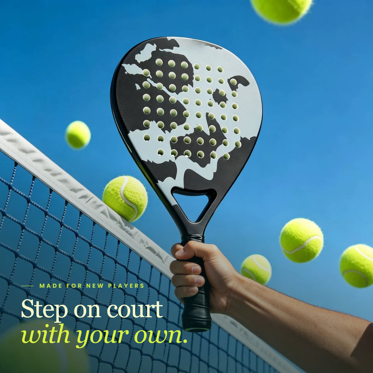 Hand holding a LobPop padel racket in Grey above the net against a blue sky
