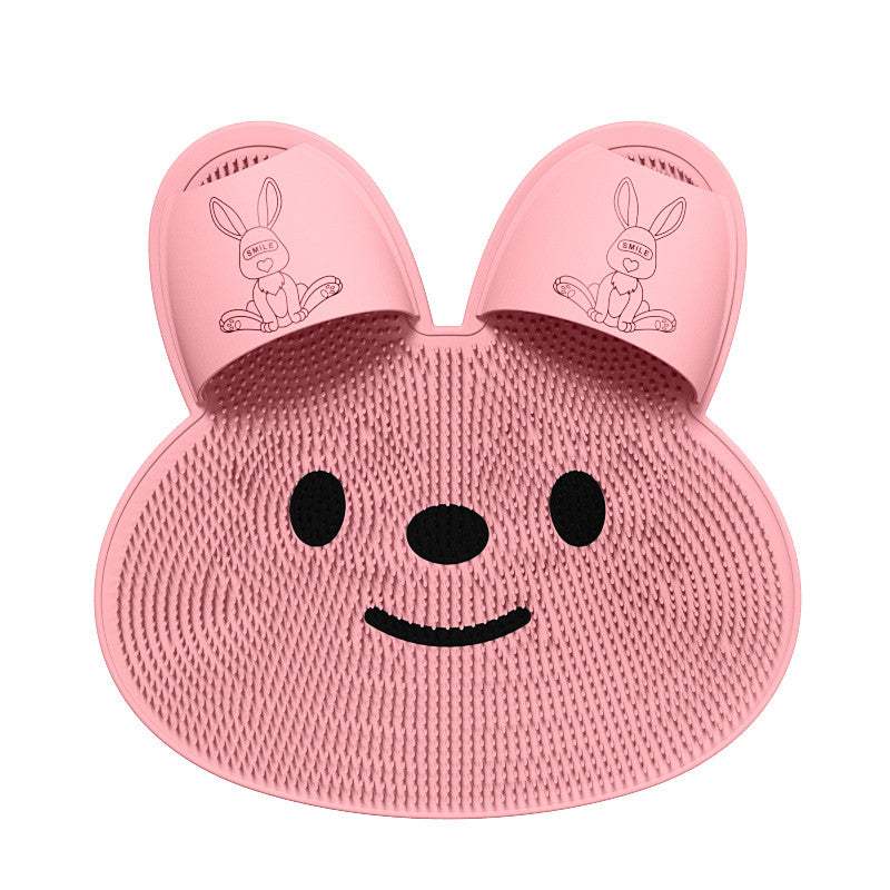 Pink bunny-shaped ToeRub shower foot brush with dense soft bristles